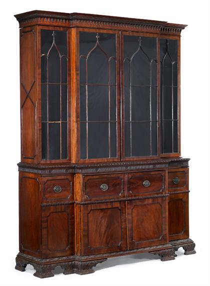 Appraisal: English mahogany breakfront bookcase th century The dentil molded and