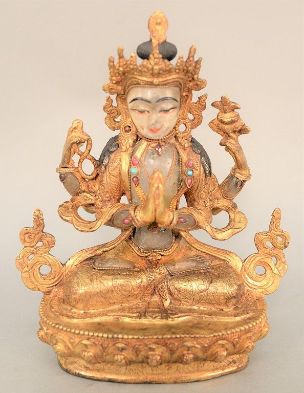 Appraisal: Chinese rock crystal and bronze deity figure in seated position