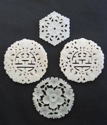 Appraisal: Four Chinese reticu lated jade discsComprising two identical fu discs