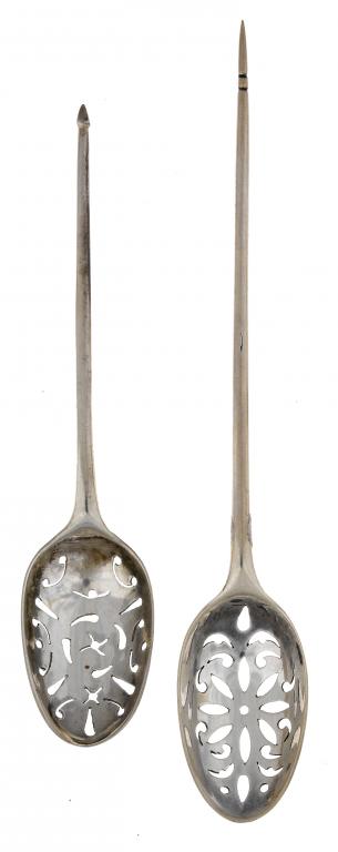 Appraisal: TWO GEORGE II MOTE SPOONS the bowls pierced with simple