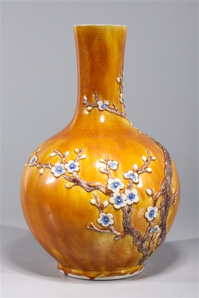 Appraisal: Chinese ochre glazed porcelain bottle vase with blossoming trees in