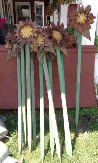 Appraisal: Ten metal flower decorations