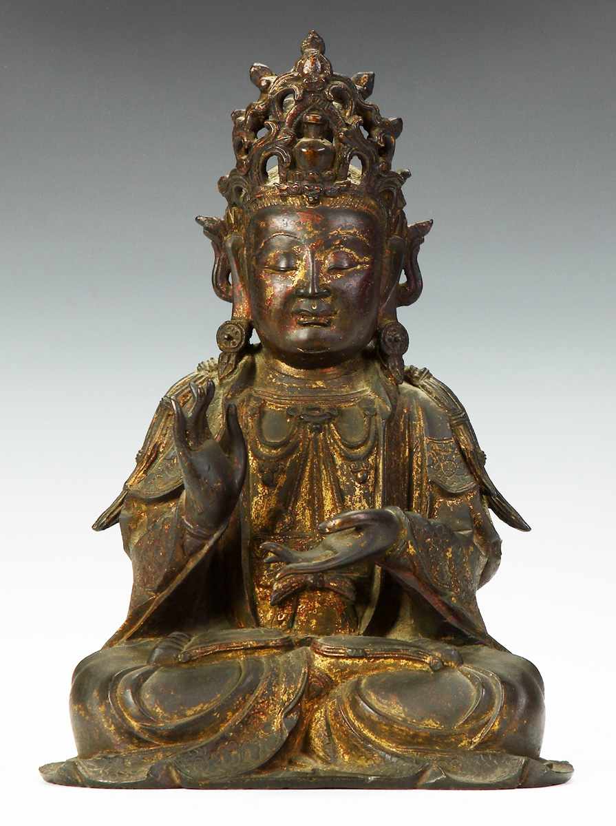 Appraisal: An Early Chinese Bronze Seated Figure of Buddha From a