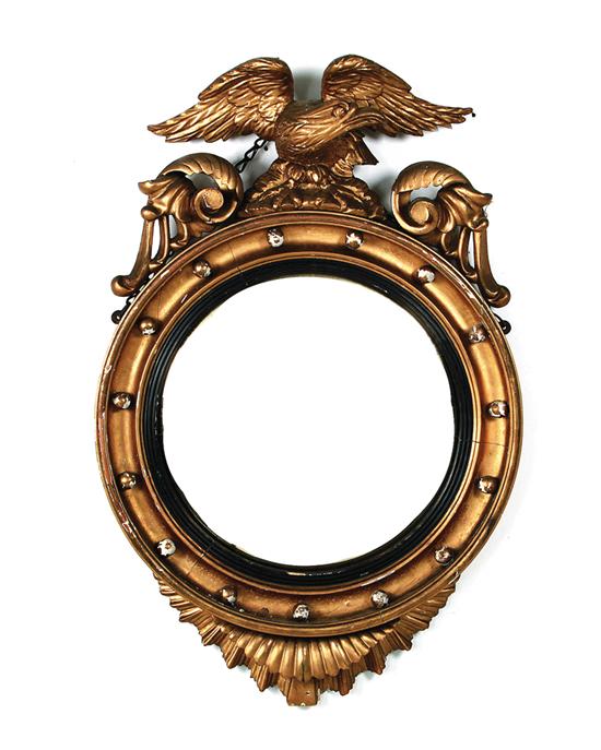 Appraisal: Federal giltwood bull's-eye mirror early th century eagle on rocky