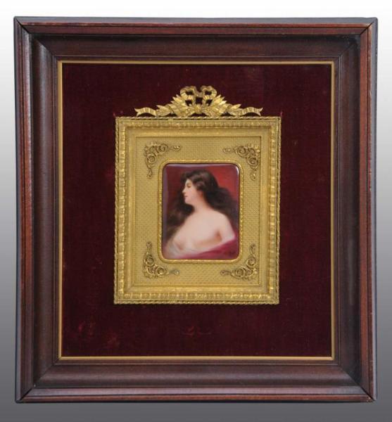 Appraisal: Porcelain Portrait of a Topless Woman Description Bronze frame and