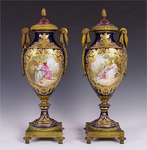 Appraisal: PAIR BRONZE MOUNTED SEVRES PORCELAIN COVERED URNS Rich in heavy