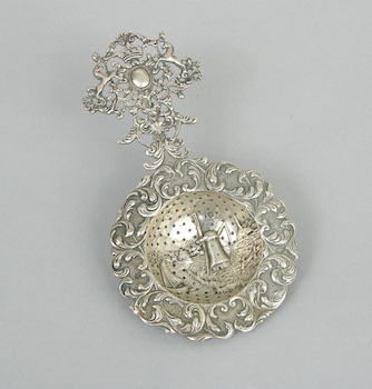 Appraisal: An Elaborate Silver Tea Strainer Dutch ca Cast and hand-finished