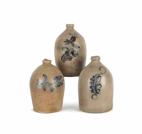 Appraisal: Three American stoneware jugs th c with cobalt floral decoration