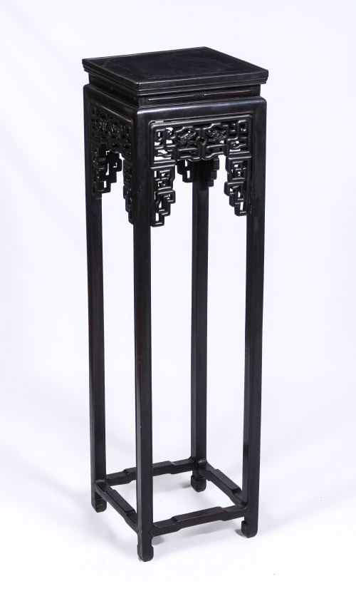 Appraisal: CARVED ORIENTAL FERN STAND Square top over openwork decoration featuring