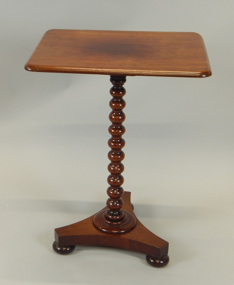 Appraisal: A Victorian mahogany occasional table the rectangular top on bobbin