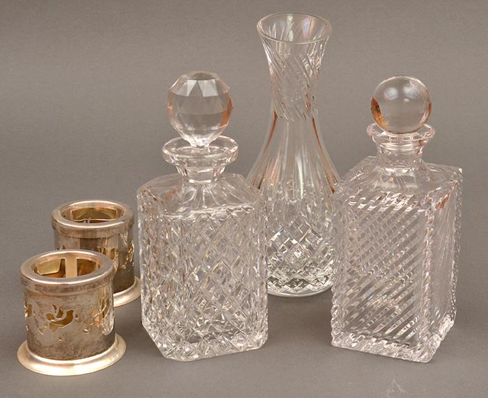 Appraisal: THREE CUT CRYSTAL DECANTERS AND FOUR CANDLE STICKS