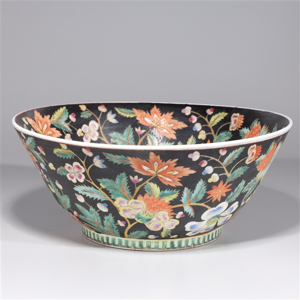 Appraisal: Large Chinese famille rose porcelain black ground bowl with allover