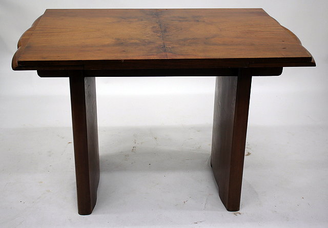 Appraisal: AN ART DECO WALNUT DRAWER LEAF DINING TABLE together with