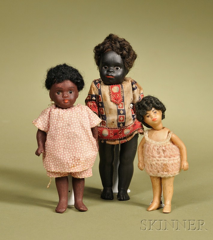 Appraisal: Three All-Bisque Black Children Germany c the largest a Kuhnlenz