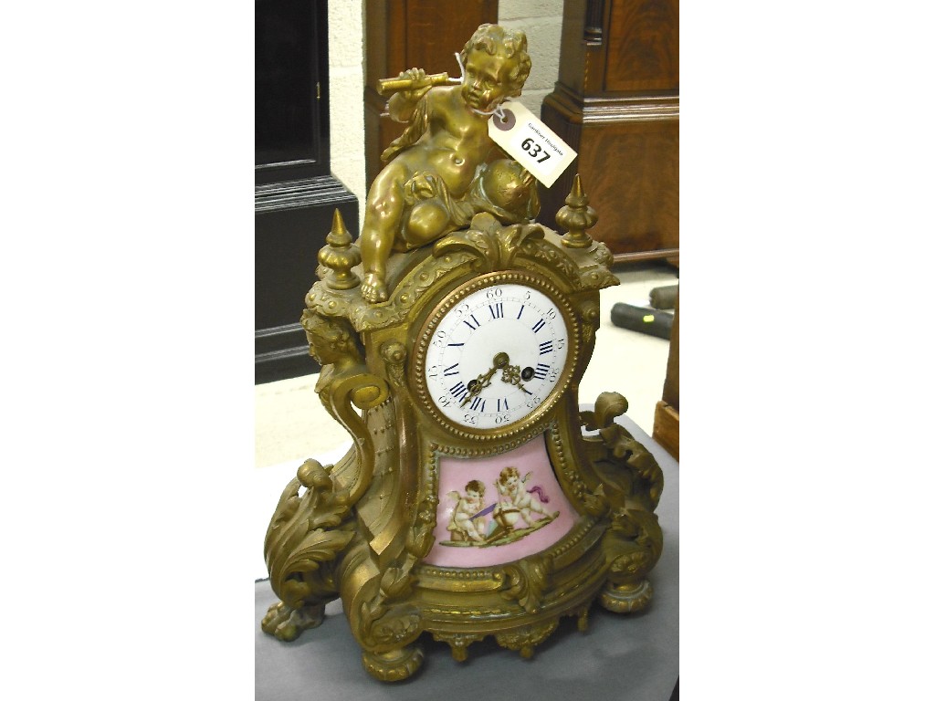 Appraisal: French gilded spelter and porcelain mounted two train mantel clock