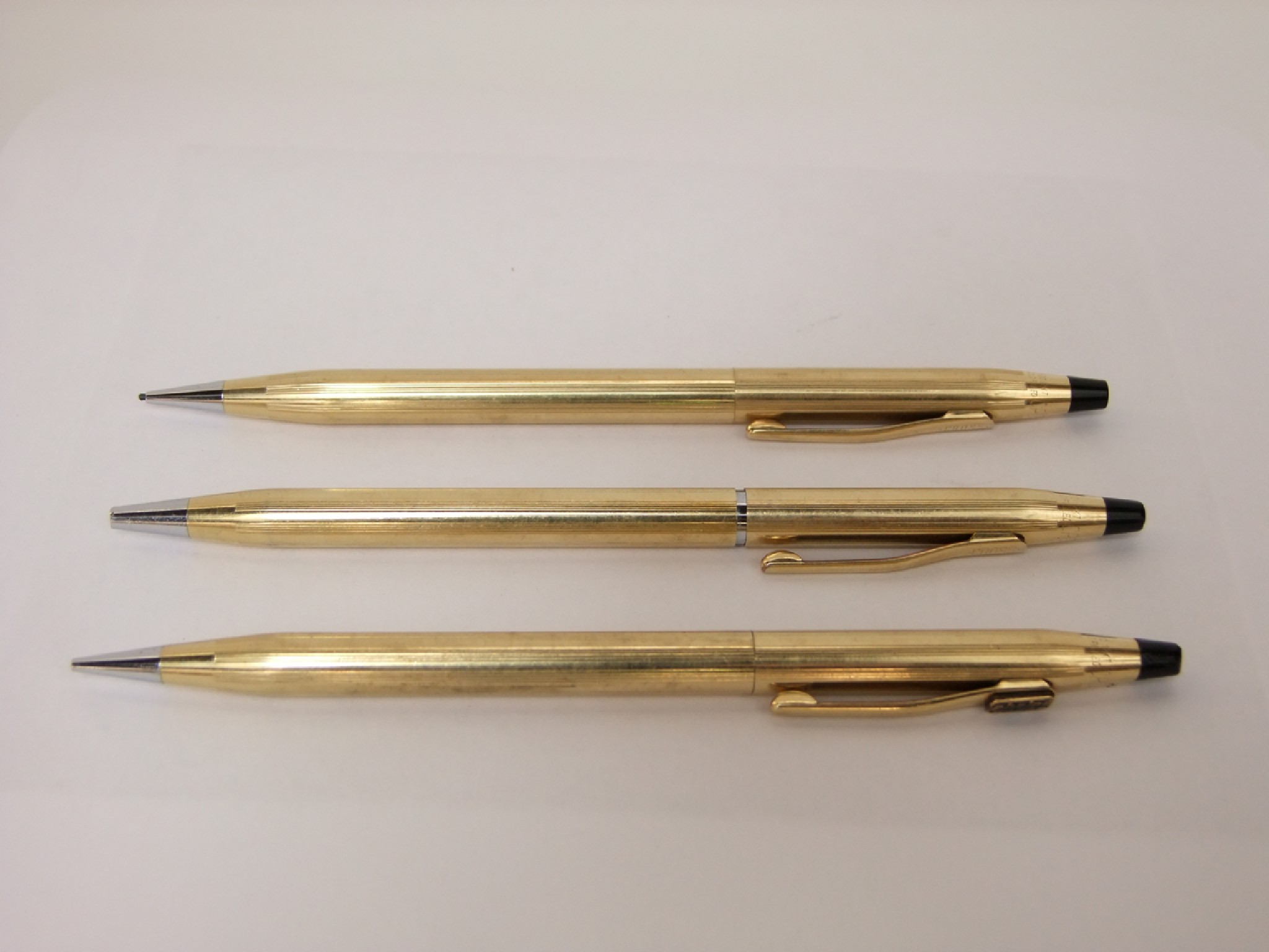 Appraisal: Three cross propelling pencils in gold plated cases