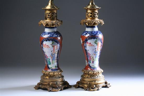 Appraisal: PAIR CHINESE MANDARIN PALETTE PORCELAIN BALUSTER VASES Qianlong period Painted