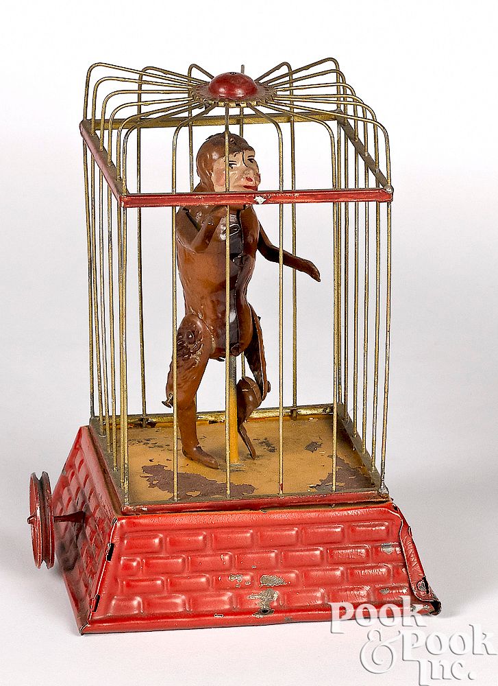 Appraisal: Dancing caged monkey steam toy accessory Painted and embossed tin