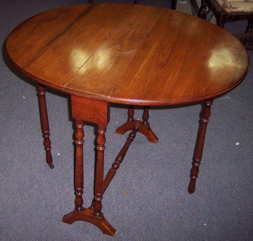 Appraisal: A late th Century walnut oval two-flap gateleg table on