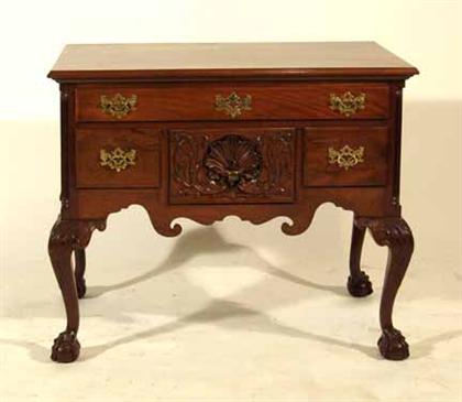 Appraisal: Chippendale-style dressing table The rectangular top with molded edge over