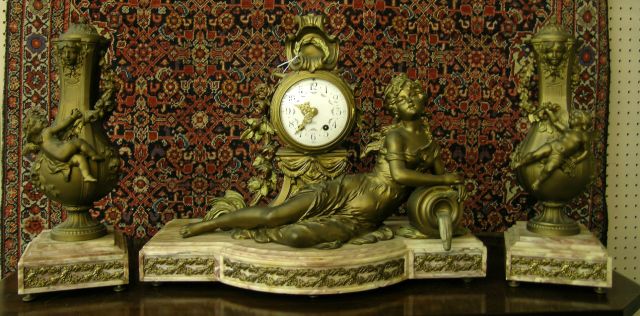 Appraisal: French Clock and Garniture figural motif on marble base with