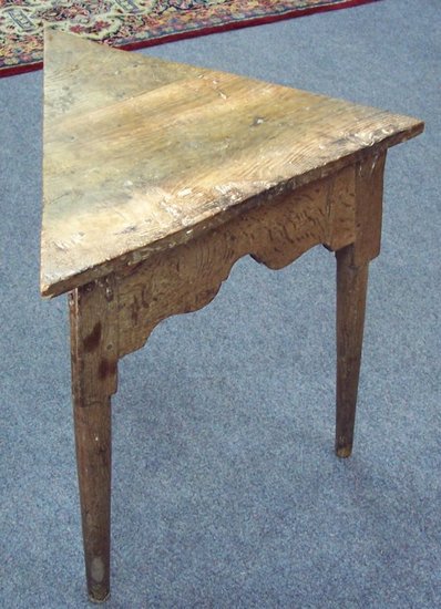 Appraisal: An elm triangular table on round legs cm wide