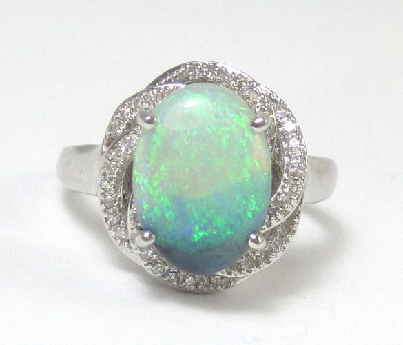 Appraisal: OPAL DIAMOND AND FOURTEEN KARAT WHITE GOLD RING the -prong