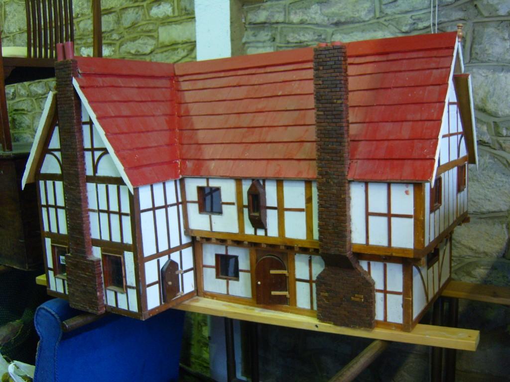 Appraisal: A substantial dolls house in the form of a timber