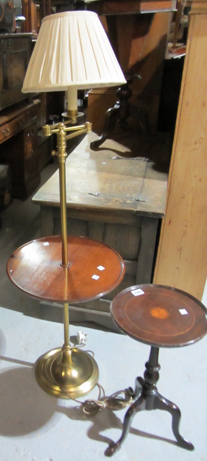 Appraisal: A th century mahogany wine table and a brass and