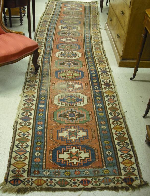 Appraisal: Caucasian Mogham style runner the pink field with a row