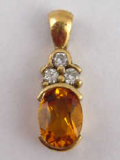 Appraisal: A citrine and diamond pendant approx cm set in yellow