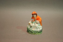 Appraisal: A Staffordshire figure of Little Red Ridinghood