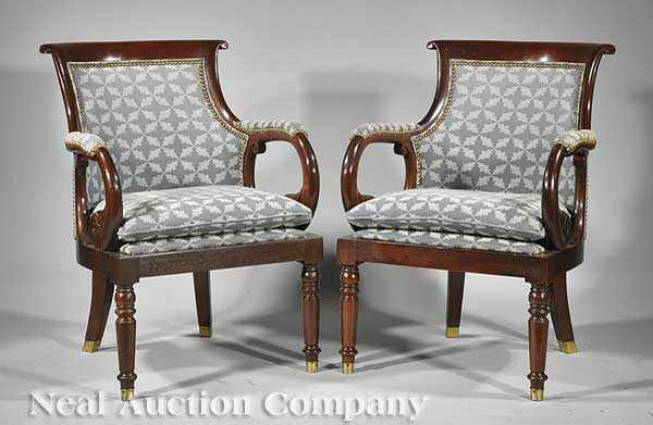 Appraisal: A Pair of Regency-Style Carved Mahogany Armchairs th c labeled