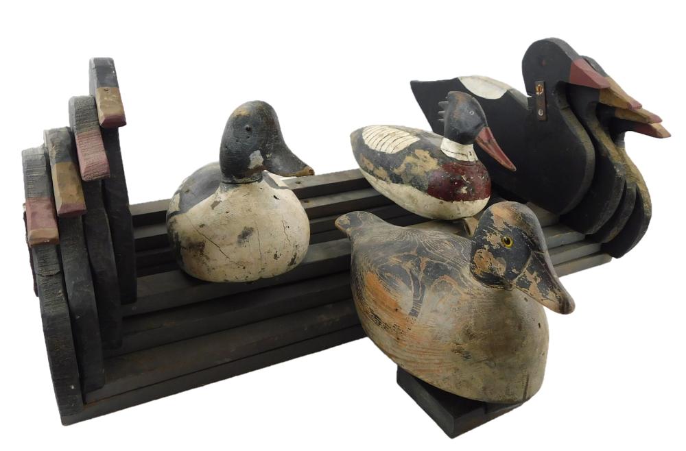 Appraisal: Vintage duck decoy flock comprised of four graduated racks and