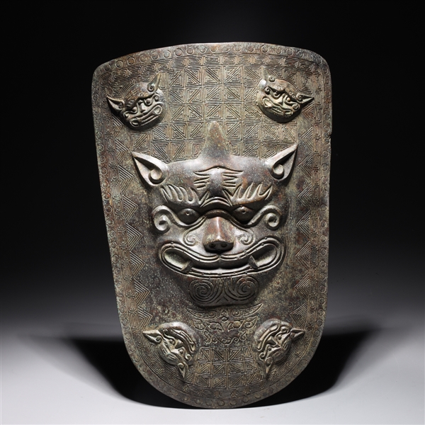 Appraisal: Chinese archaistic bronze lion shield with allover incised designs overall