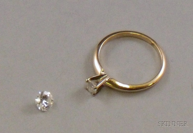 Appraisal: kt Gold and Diamond Solitaire and an Unmounted Round-cut Diamond