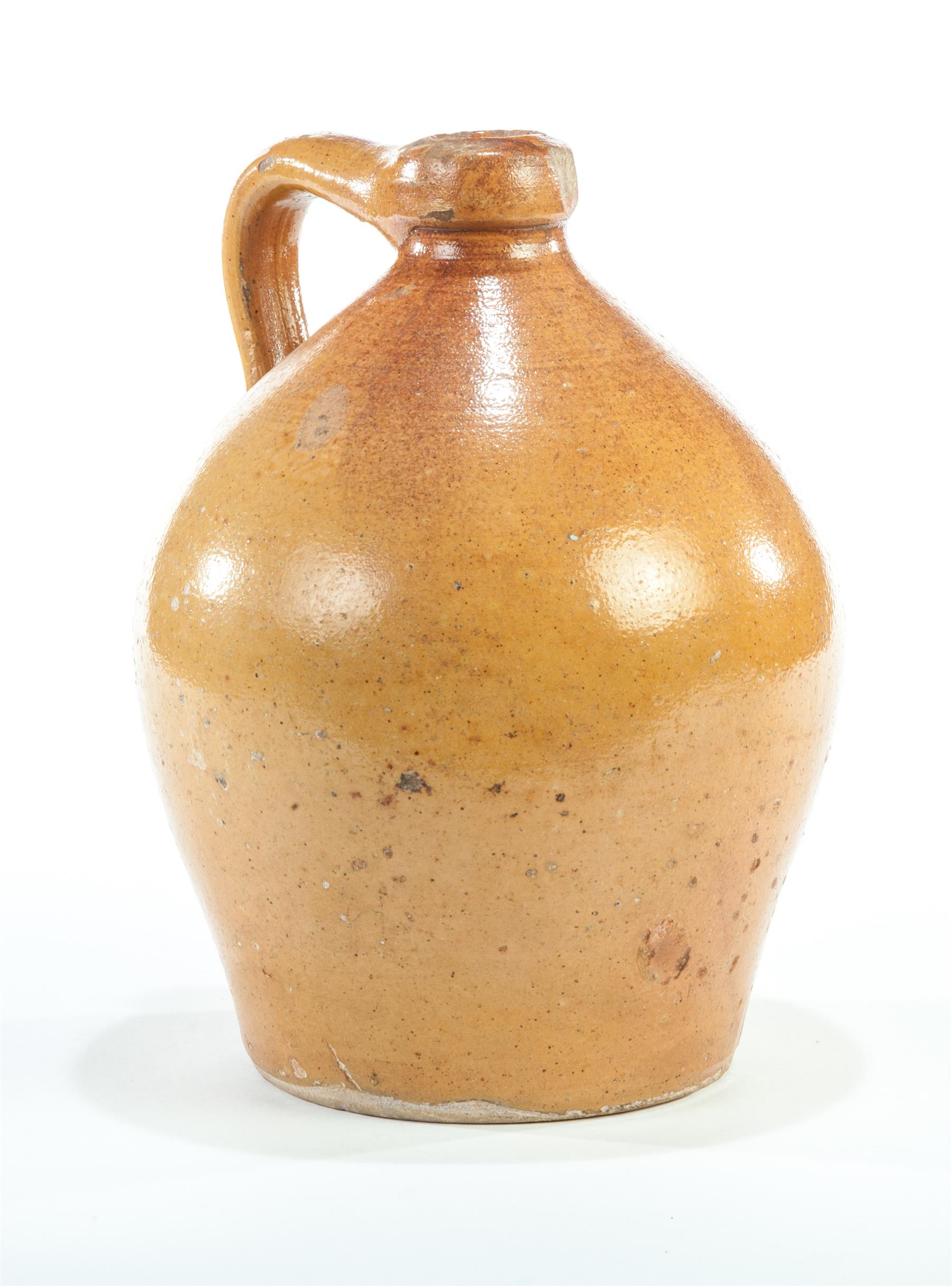 Appraisal: AMERICAN OVOID BUFF CLAY JUG Mid th century Applied handle