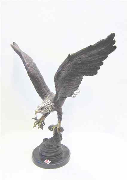 Appraisal: POLYCHROME BRONZE WILDLIFE SCULPTURE of an eagle with fish wings