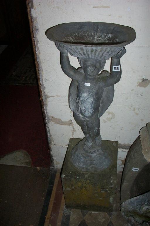 Appraisal: A lead bird bath in the form of a winged