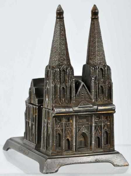 Appraisal: Silver Lead Cologne Cathedral Still Bank Description Manufactured in Germany