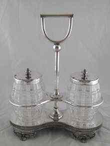 Appraisal: A plated two jar stand with cut glass jars for