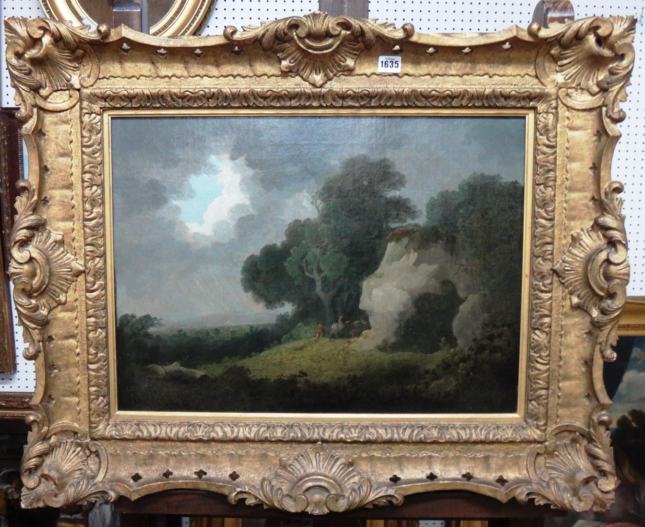 Appraisal: Circle of George Morland Wooded landscape with travellers sheltering from