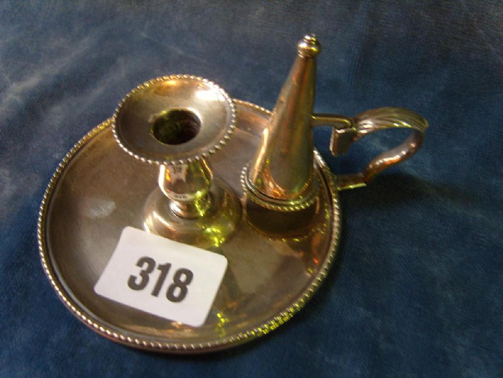 Appraisal: A small Georgian silver chamberstick with shaped handle and beaded