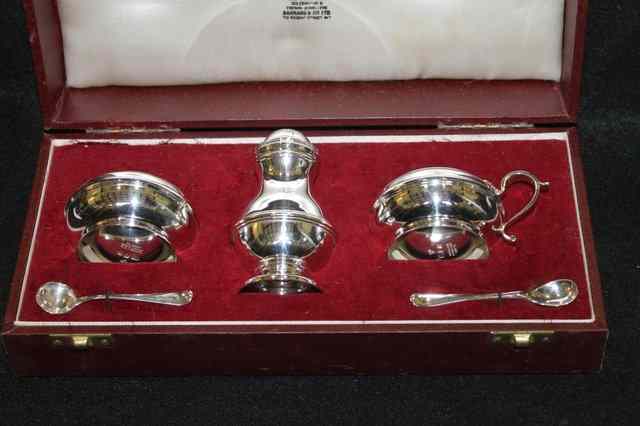 Appraisal: A SILVER THREE PIECE CONDIMENT SET comprising a mustard pot