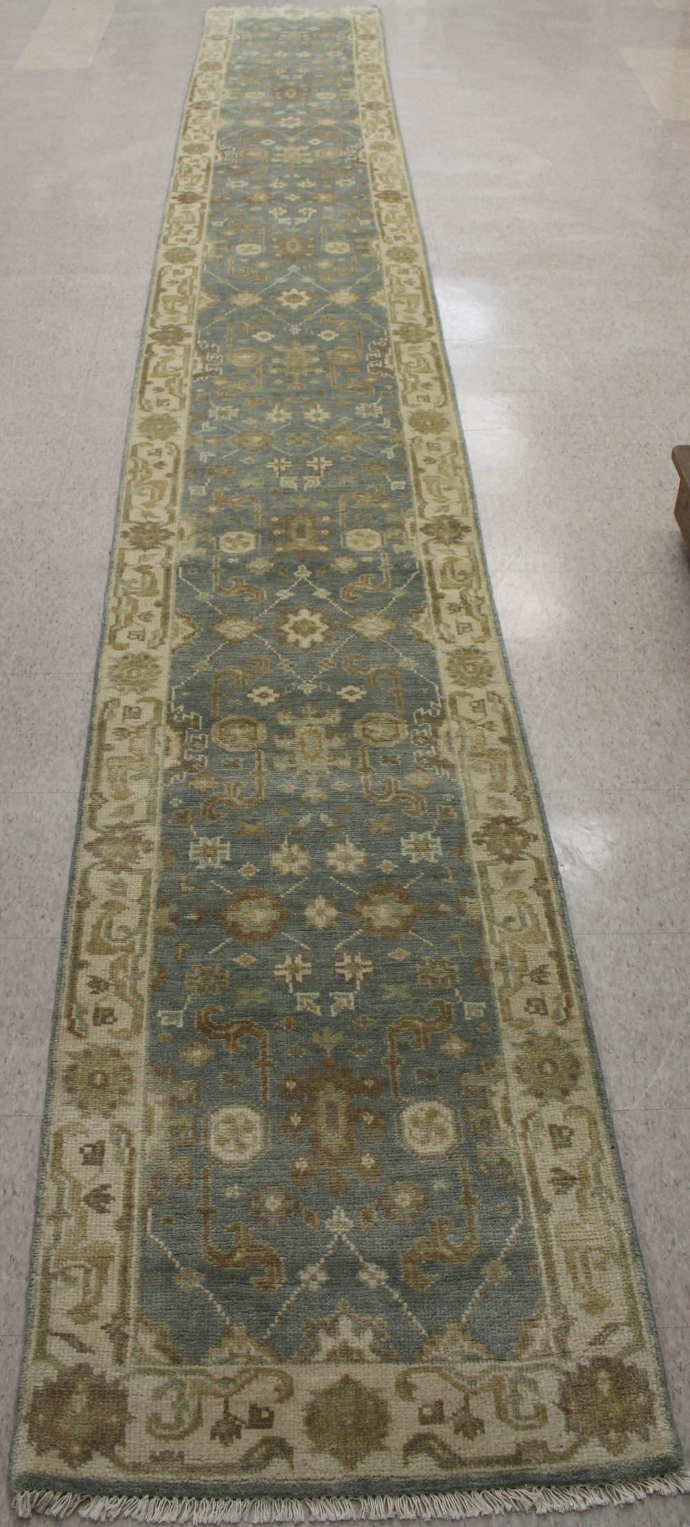 Appraisal: HAND KNOTTED ORIENTAL LONG RUG Indo-Persian stylized floral design on