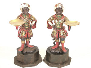 Appraisal: A pair of monkey Blackamoor style stick stands th century