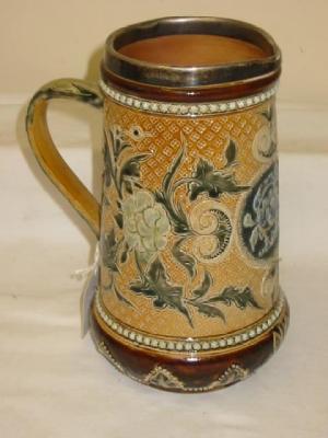 Appraisal: A DOULTON LAMBETH STONEWARE JUG of tapering form with silver