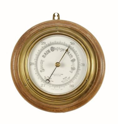 Appraisal: A brass cased bulkhead type aneroid barometer with a in