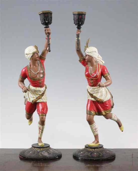 Appraisal: A pair of late th century painted spelter figural candlesticks