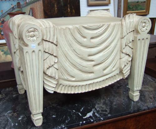 Appraisal: A pair of carved and cream painted stools after a